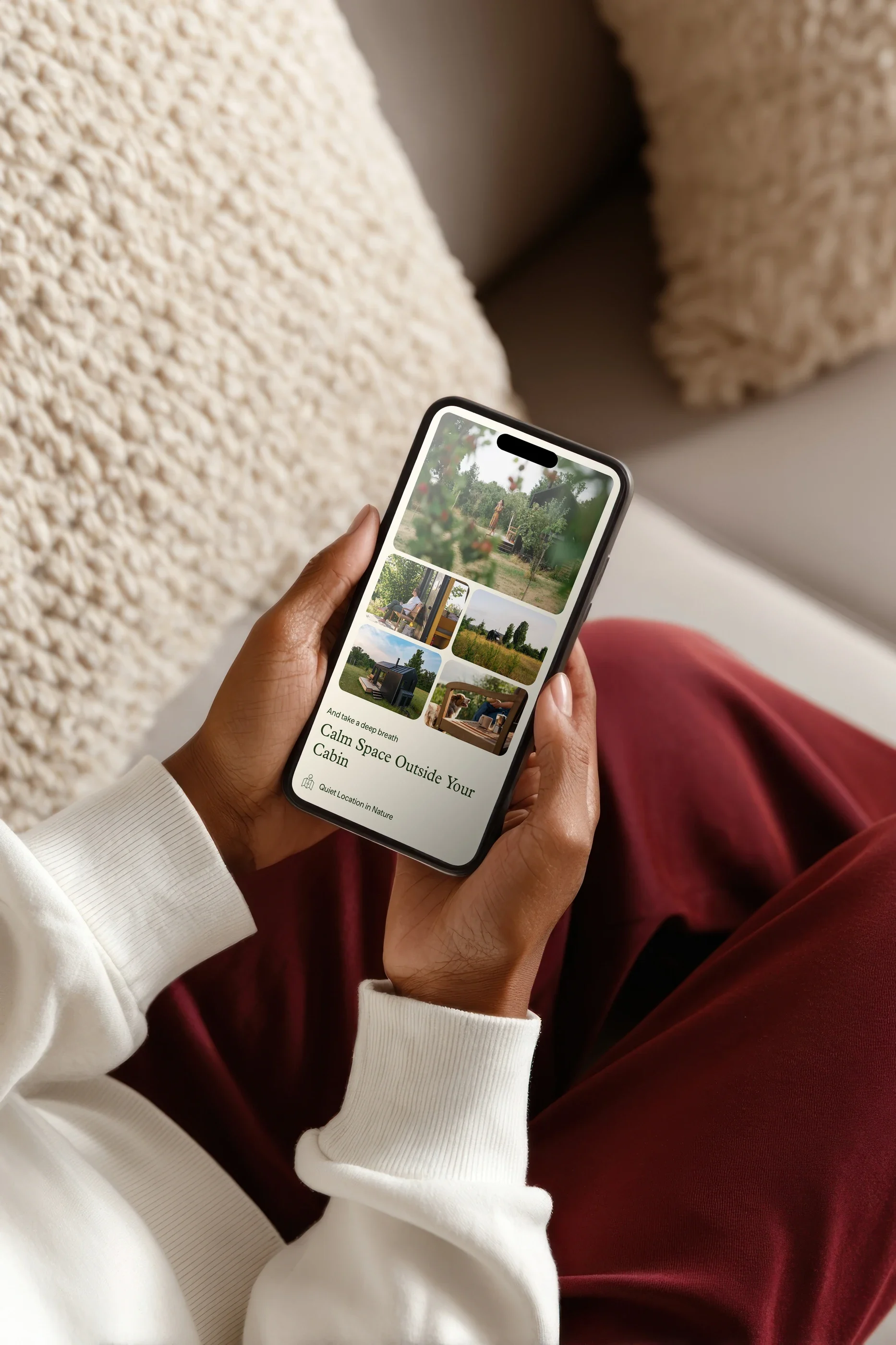 The 'Calm space outside your cabin' section on a phone, held on a sofa
