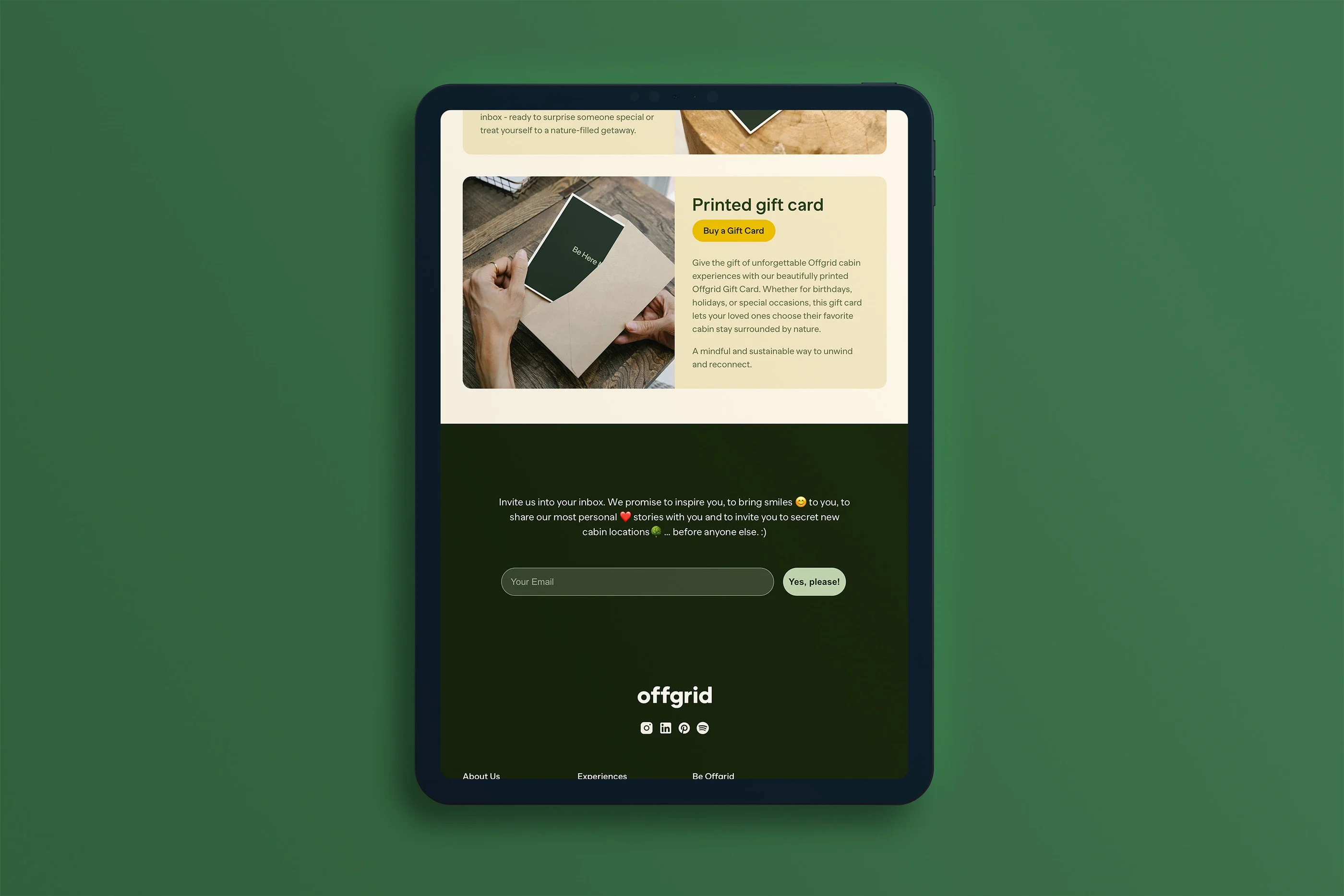 The printed gift card and newsletter sign-up on a tablet, against green