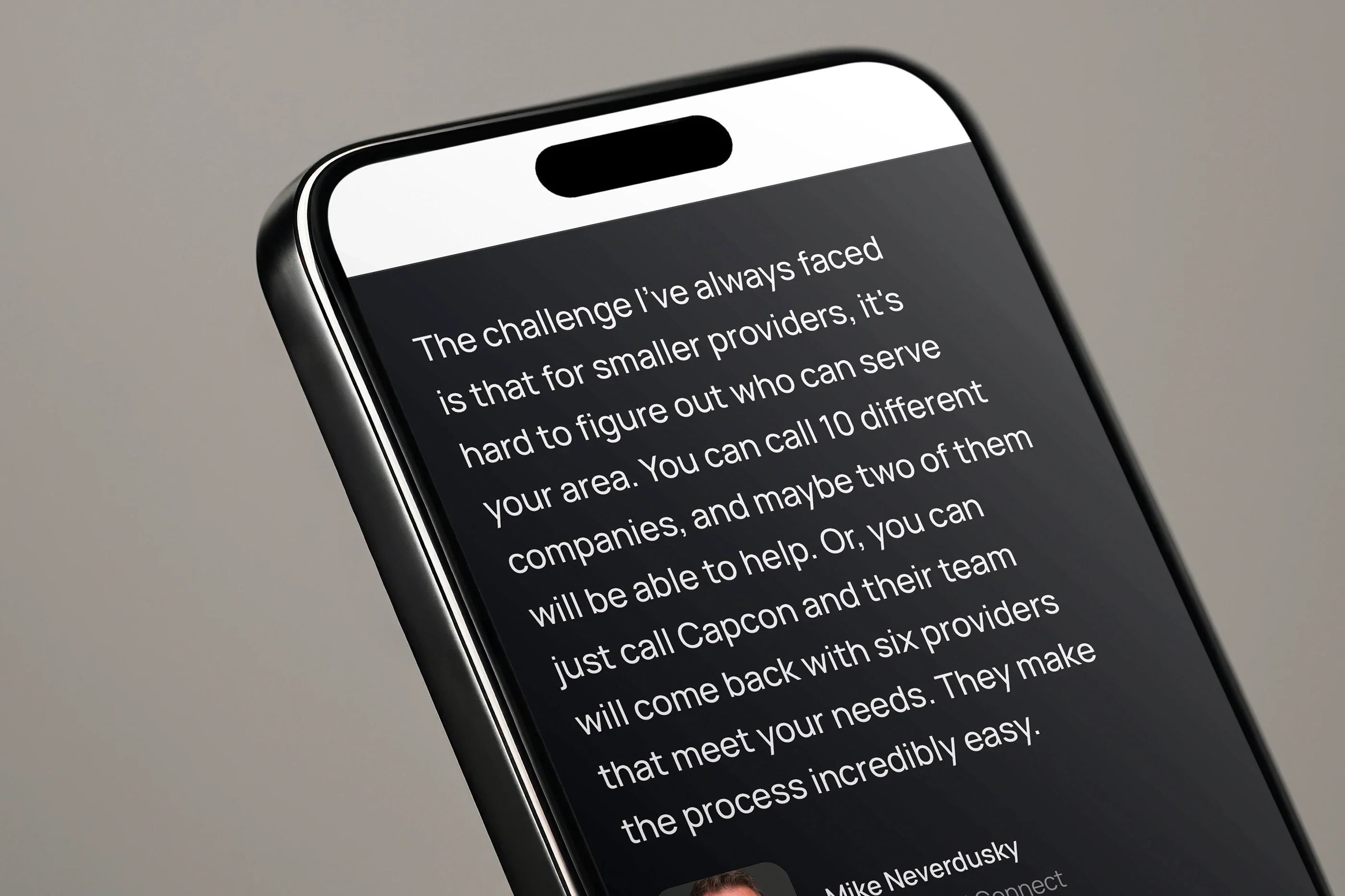 A customer's testimonial from the home page on a phone, close up