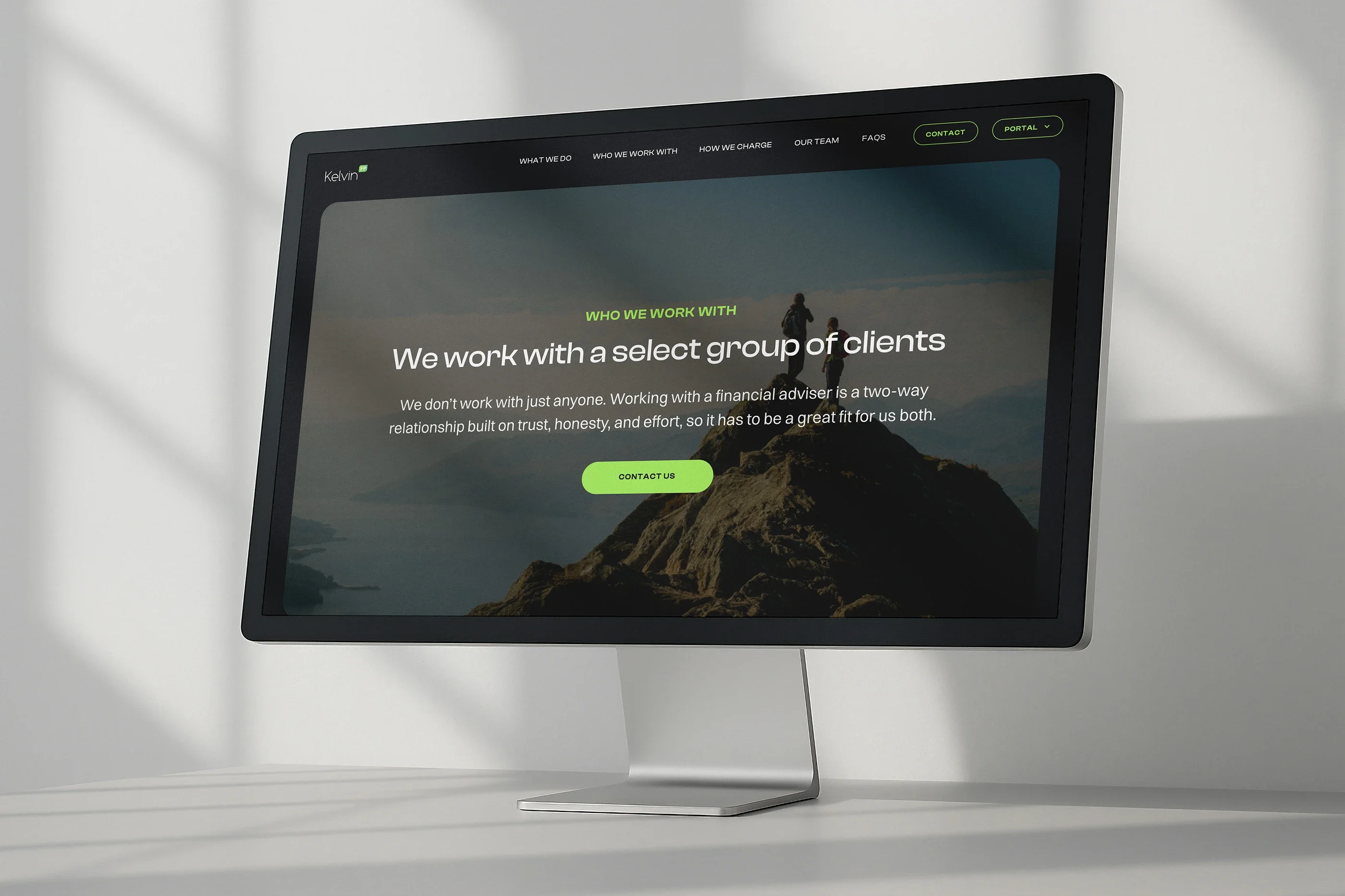 The Who we work with page on a desktop monitor: 'We work with a select group of clients', over a walker on a summit